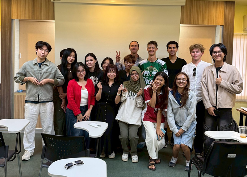 A group picture of an APCD representative, Ms. Thorfan Dechachainimit, with 15 students and Professor Kavin Cook in class on Civil Society Management.