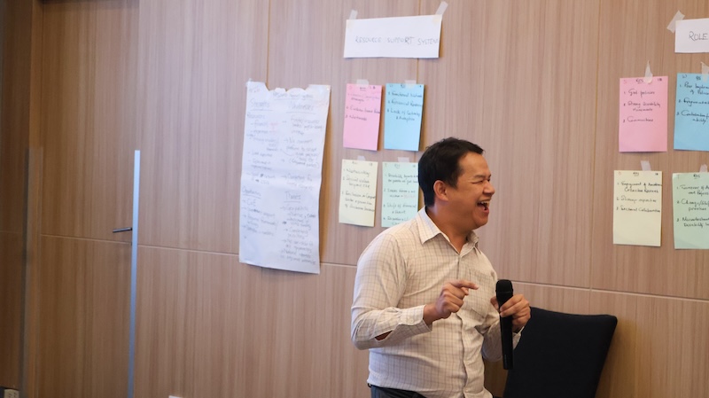 Photo 6: Mr. Watcharapol Cheungcharoen announced on logistic arrangement to the participants and encouraged the participants to evaluate the workshop.