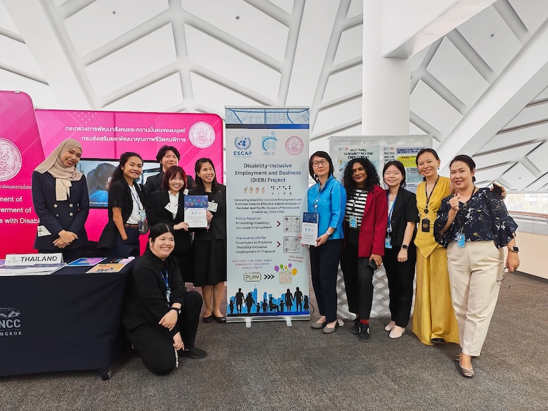 A group photo of ESCAP, APCD and DEP working group on DIEB at the booth, emphasizing pioneer collaboration on DIEB in Thailand
