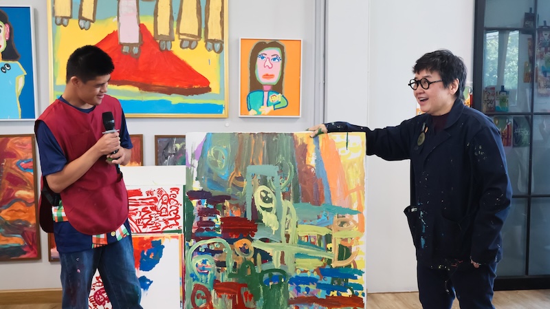 Intellectual disabilities artist presenting his artwork